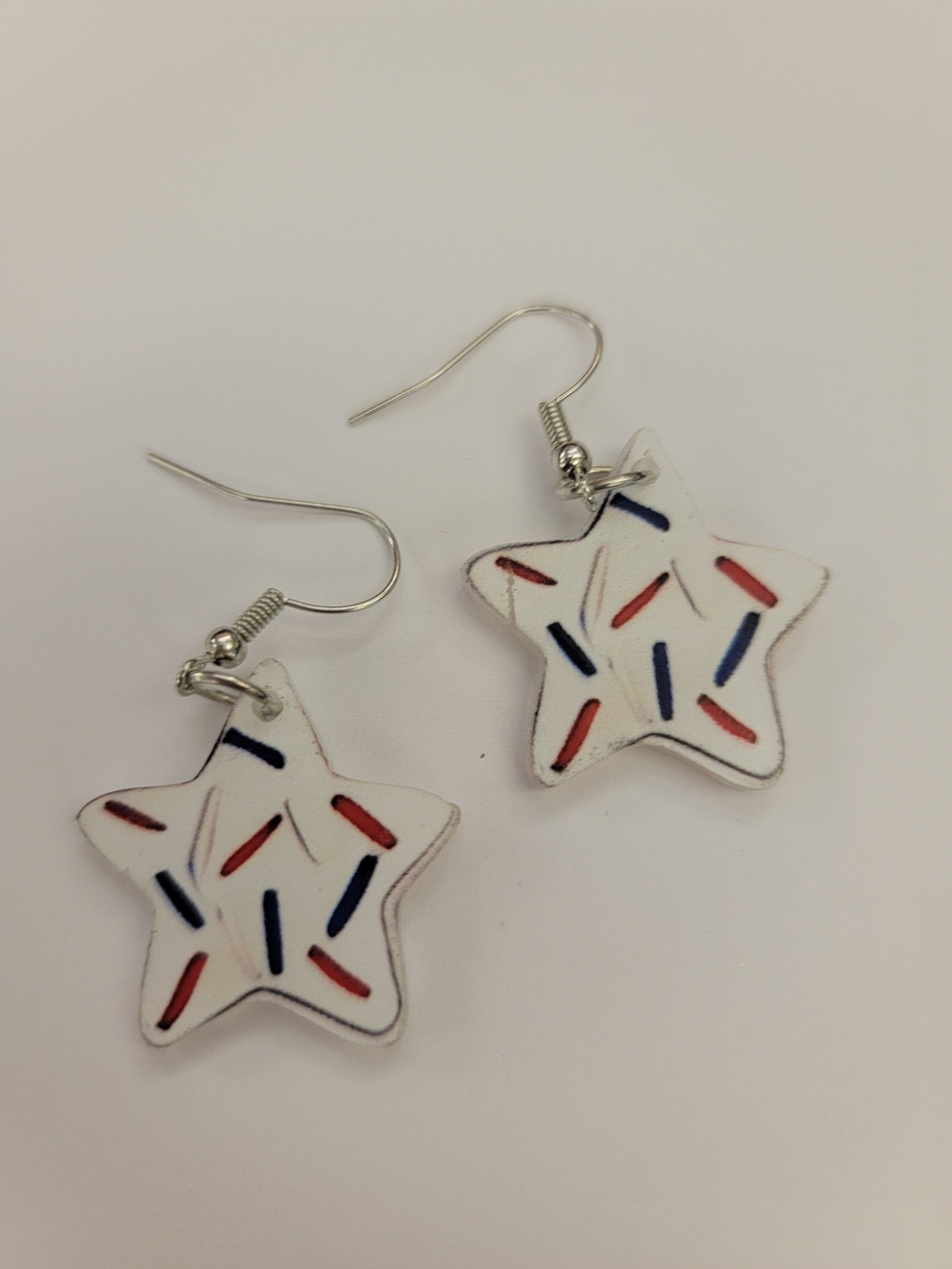 Star Shaped Dangle Earrings in White with Red & Navy Sprinkles